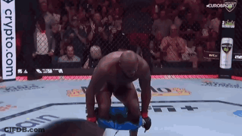 Man Kneeling In Boxing Ring Crypto.com Ad GIF