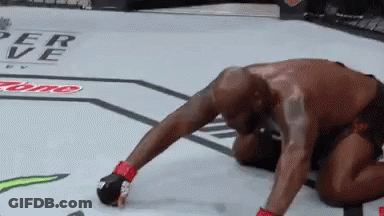 Man Kneeling In Boxing Ring GIF