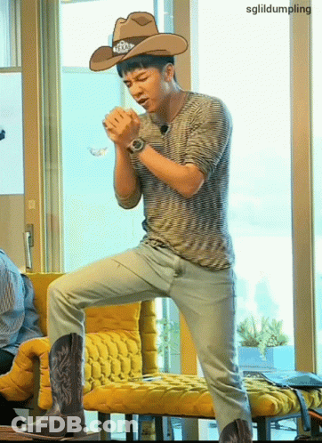 Man Kneeling In Cowboy Hat And Boots GIF