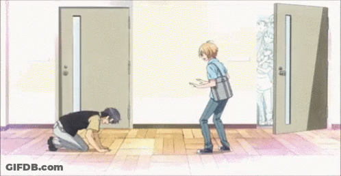 Man Kneeling In Front Of Door With Another Man Standing GIF