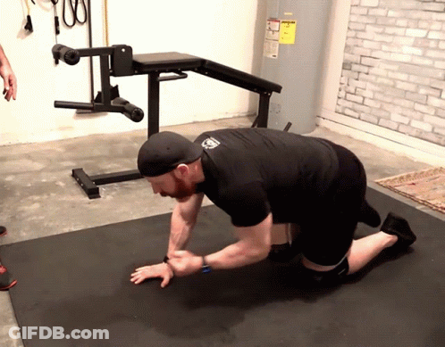 Man Kneeling In Front Of Water Heater GIF