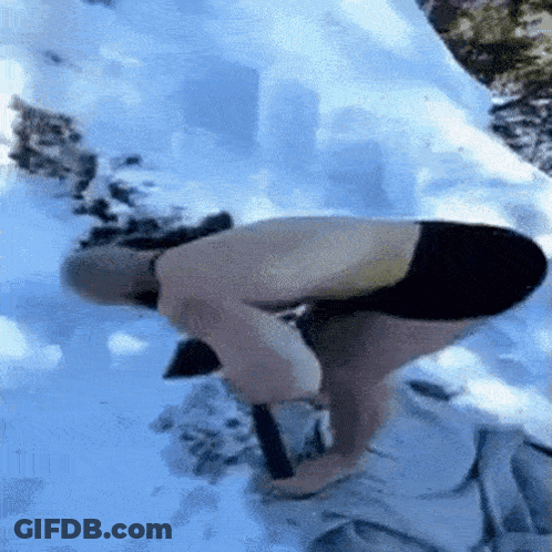 Man Kneeling In Snow Without Shirt GIF