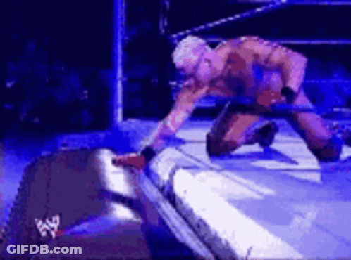 Man Kneeling In Wrestling Ring GIF