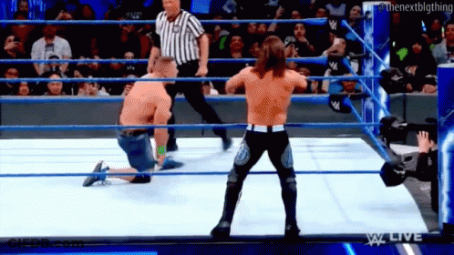 Man Kneeling In Wrestling Ring GIF