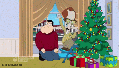 Man Kneeling Next To Christmas Tree Saying American Dad All New GIF