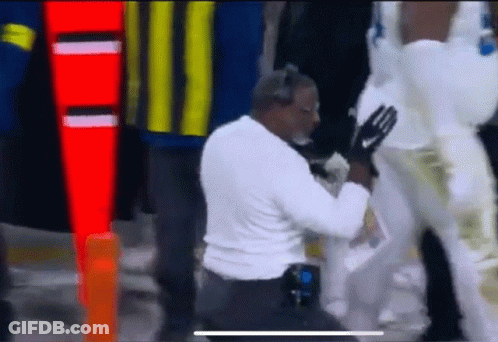 Man Kneeling Next To Man In White Pants GIF