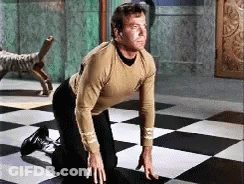 Man Kneeling On Checkered Floor GIF