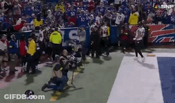 Man Kneeling On Football Field During Game GIF