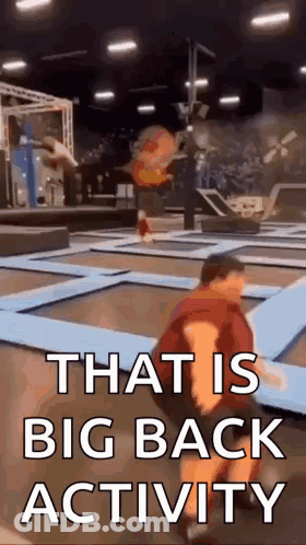 Man Kneeling On Trampoline That Is Big Back Activity GIF