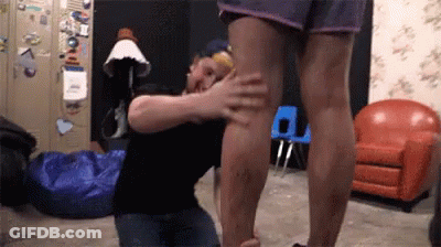 Man Kneeling Touching Woman's Leg GIF