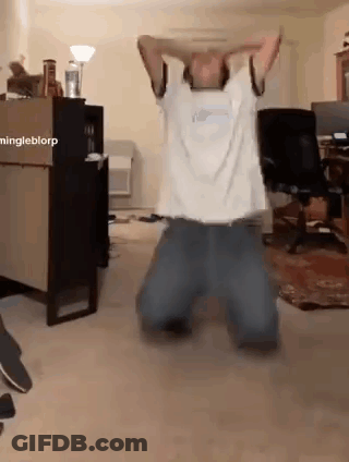 Man Kneeling With Arms Over Head GIF