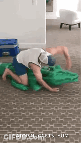 Man Kneeling With Crocodile Costume GIF