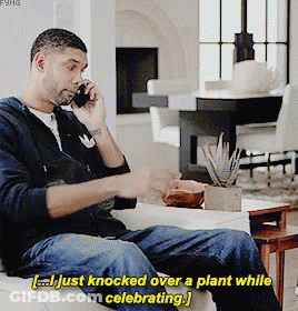 Man Knocking Over Plant While Celebrating GIF