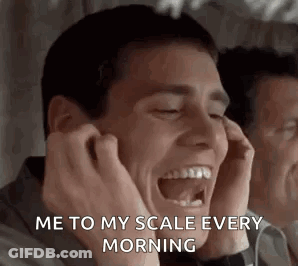 Man Laughing Covering Ears In Mirror GIF
