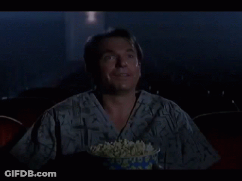 Man Laughing Holding Bowl Of Popcorn GIF