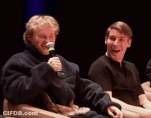 Man Laughing Holding Microphone GIF
