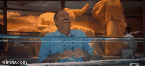 Man Laughing In Front Of Statue GIF