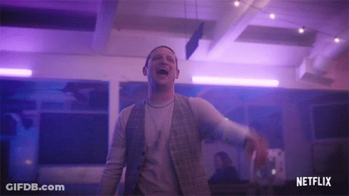 Man Laughing In Purple Lit Room With Netflix Logo GIF