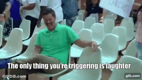 Man Laughing In Row Of Chairs GIF