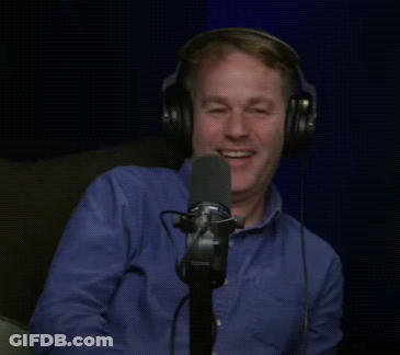 Man Laughing Into Microphone With Headphones GIF