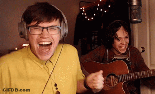 Man Laughing With Headphones And Guitar GIF
