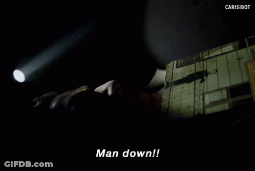 Man Laying Down Hand Pointing Says Man Down GIF