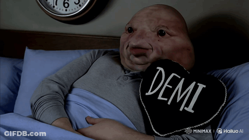 Man Laying In Bed With Demi Pillow GIF