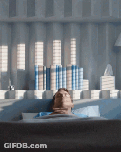 Man Laying In Bed With Eyes Closed GIF