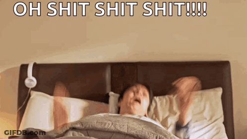 Man Laying In Bed With Headphones Saying Oh Shit GIF