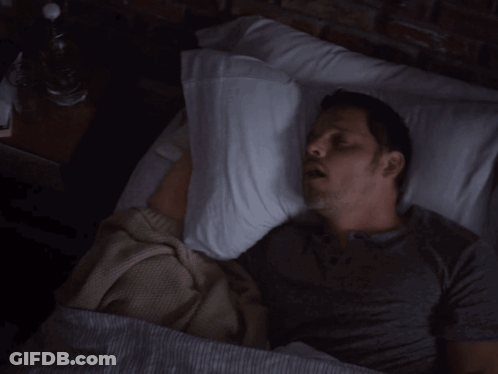 Man Laying In Bed With Pillow On Head GIF