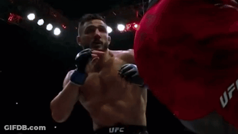 Man Laying In Boxing Ring With Crypto.com Sign GIF