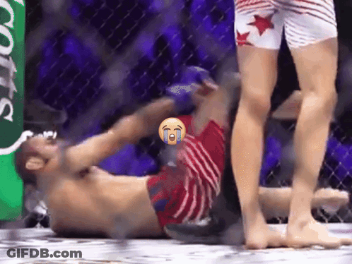 Man Laying In Boxing Ring With Smiley Face GIF