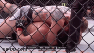 Man Laying In Cage With Number 30 On Arm GIF