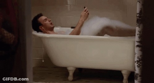 Man Laying In Foam Bathtub GIF
