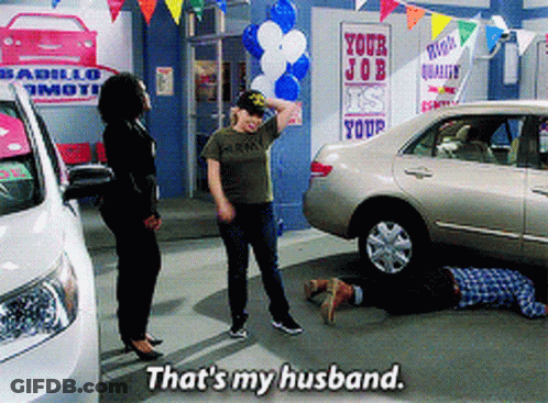 Man Laying In Front Of Car Saying That's My Husband GIF