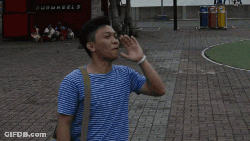 Man Laying In Front Of Ghowwheels Sign GIF