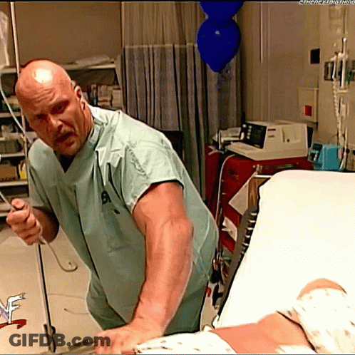 Man Laying In Hospital Bed With Fist Up GIF