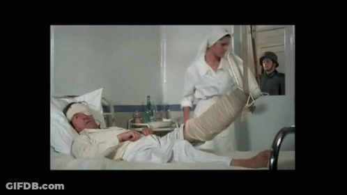 Man Laying In Hospital Bed With Leg Bandage GIF