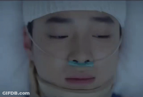 Man Laying In Hospital Bed With Leg Bandage GIF