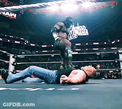 Man Laying In Wrestling Ring Raw Sign GIF