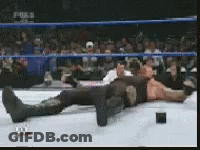 Man Laying In Wrestling Ring With Fox Logo GIF