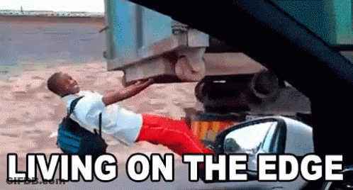Man Laying Next To Car Living On The Edge GIF
