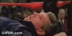 Man Laying On Back In Boxing Ring Eyes Closed GIF