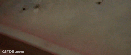 Man Laying On Back In Dark Room Eyes Closed GIF