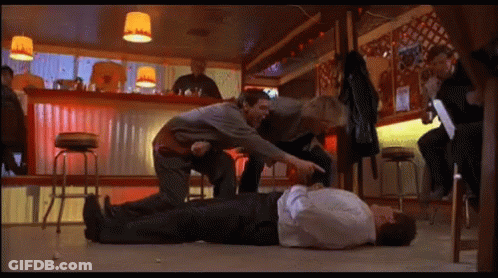 Man Laying On Bar Floor Pointed At GIF