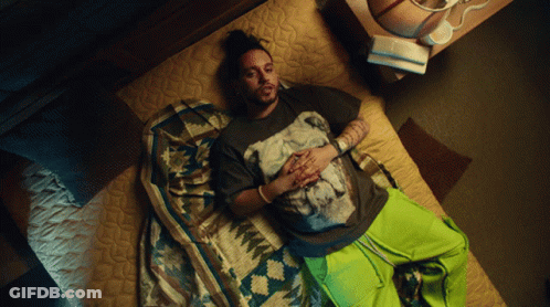 Man Laying On Bed In Horse T-Shirt GIF
