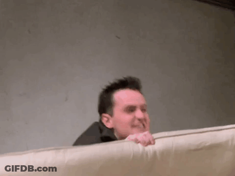 Man Laying On Bed Making Funny Face GIF