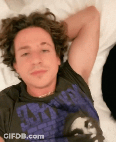 Man Laying On Bed Wearing Apocalypse T-Shirt GIF