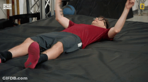 Man Laying On Bed With Breaking Bobby Bones GIF