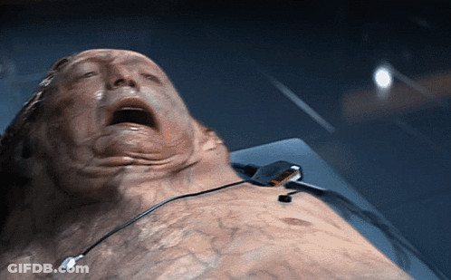 Man Laying On Bed With Mouth Open GIF